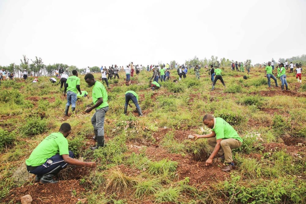 Residents during a tree planting exercise at Mount Rebero in Kicukiro District.  The City of Kigali set to plant more trees  to mitigate floods and improve air quality in Kigali City.