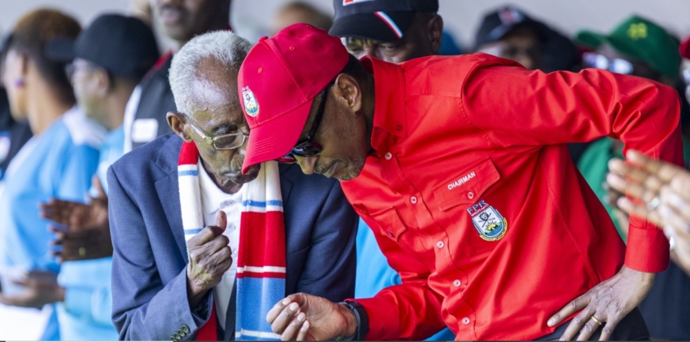 With a clenched fist and a scarf in RPF colours, this senior citizen looked the part as he whispered something in President Kagame&#039;s ear during the latter&#039;s campaign rally in Kirehe on July 2. File